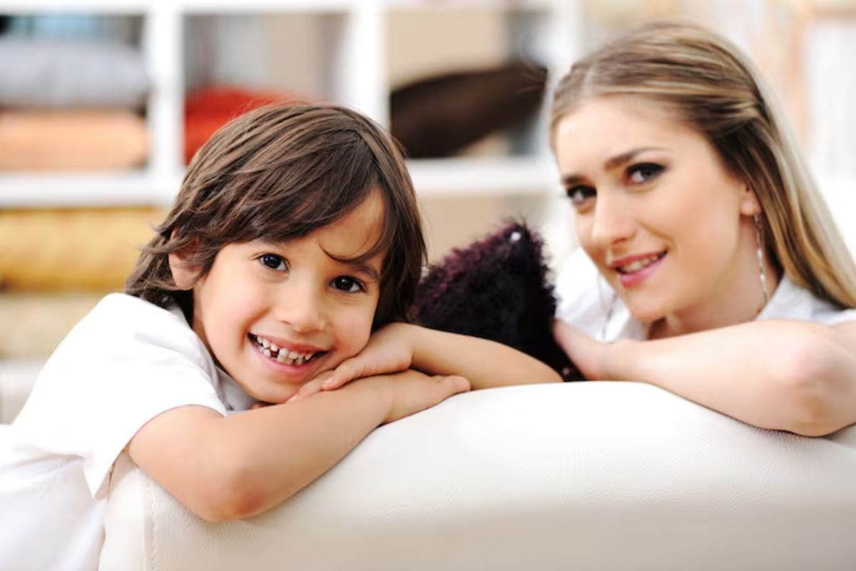 parent and child smiling together while discussing invisalign and braces for kids.